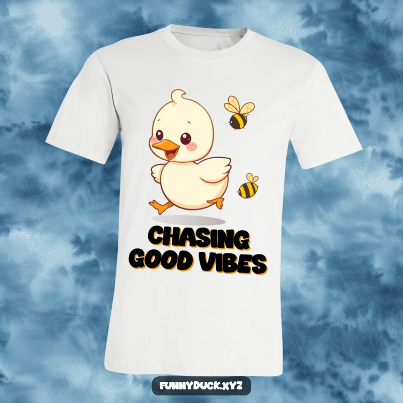 Funny Kawaii Duck T-Shirt illustrating a duck's playful chase after a tiny buzzing bee, with a big smile.